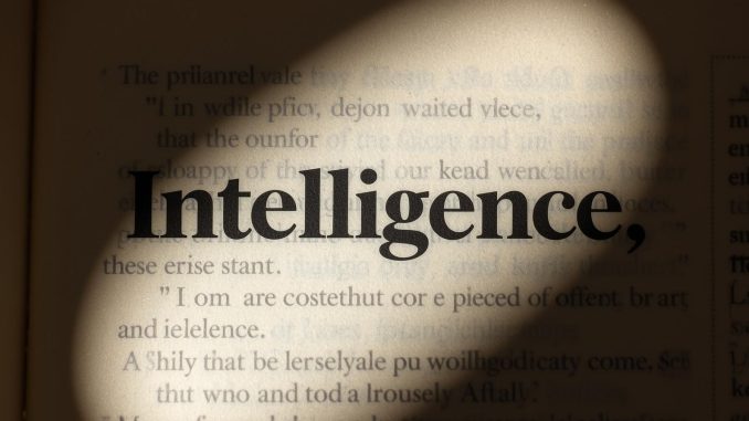 A single dictionary page with the word Intelligence blurred